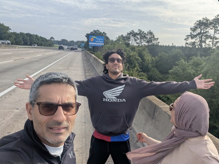 Family selfie on a road trip at the Georgia state line