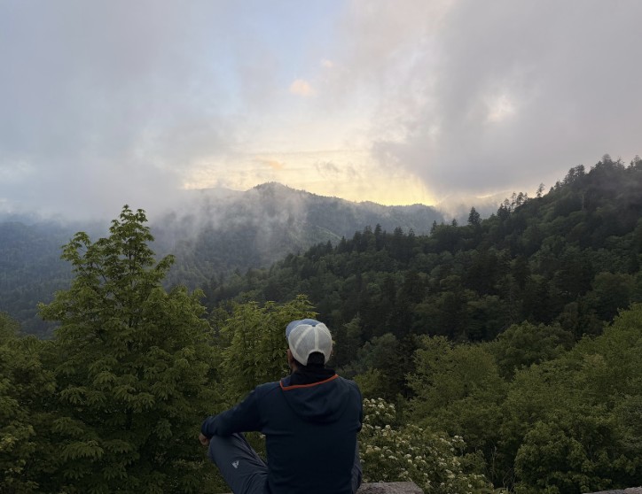 Sitting at a foggy mountain overlook