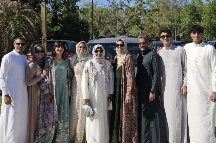 Extended family group photo dressed up for Eid